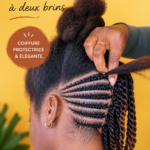 Femme avec un chignon Flat Twist élégant sur cheveux crépus.
