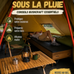 Allumer un feu de camp sous la pluie, une femme souriante s'active autour du foyer.