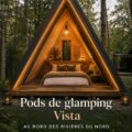 Vue des pods de glamping au bord de la rivière, décor naturel et confortable.